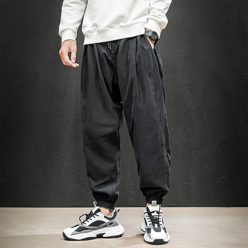 2024 Brand Men's Casual Sports Pants Fashion Bind feet Button Outdoors Men Elastic Zipper Bunched Foot Trousers